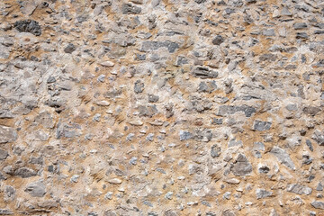 Wall Mural - Stone wall texture background. Old stonewall traditional pattern building facade, natural material