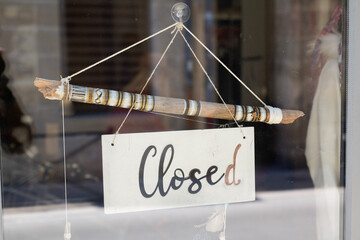 Wall Mural - closed boutique text sign board door entrance on windows shop door restaurant cafe store signboard