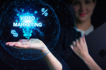 Business, Technology, Internet and network concept. Young businessman working on a virtual screen of the future and sees the inscription: Video marketing