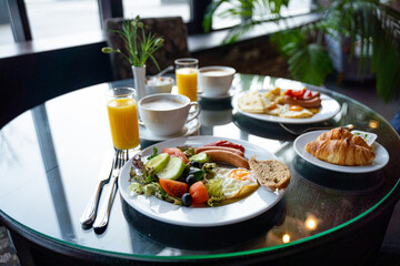 Delicious Breakfast for Two at the Luxury Hotel, Eggs, Sausages, Vegetables, Croissants Coffee, Orange Juice