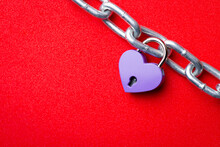 Chain With Purple Lock-heart On Red Background. Concept Of Love, Relationship, Engagement