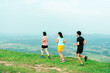 © Ekkasit A Siam - Asian man and woman trail runner running. On the high mountains, beautiful scenery. It's a trail running practice. on a bright day Behind is a beautiful mountain view..