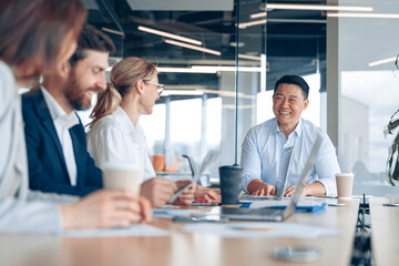 Wall Mural - Workteam of young asian businessman working and communicating together in an modern office. 