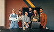 Leinwandbild Motiv Diverse business team standing in a boardroom