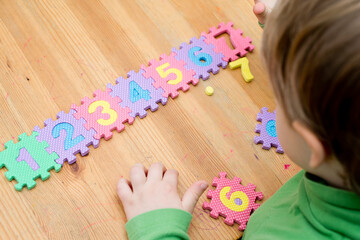 two year boy plays with Foam Puzzle Mat Learning numbers. counting Study Kids numeric Floor Play toy Education Learning Toys