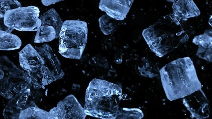 Aufkleber - Super slow motion of falling ice cubes separated on black background. Filmed on high speed cinema camera, 1000 fps.