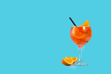 Glass Of Aperol Spritz Cocktail On Blue Background