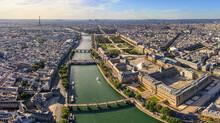 Panoramic Aerial View Of Le Louvre Museum Along The Seine River In Paris Downtown, France.