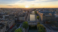 Panoramic Aerial View Of The Seine River Crossing Paris Downtown At Sunset, Paris, France.