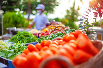 Wall Mural - Selective focus of green bell pepper with vegetable ingredient for cooking in ceremony party or outdoor hotel garden event and Chef in white uniform in background. Food Buffet and fine dining concept