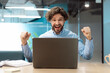 © Prostock-studio - Excited businessman using pc celebrating success shaking fists screaming yes
