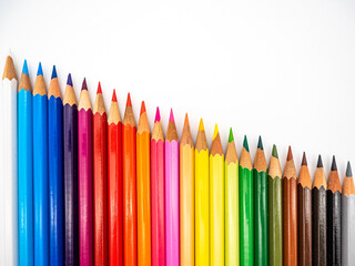 Wall Mural - Row of colored pencils isolated on a white background