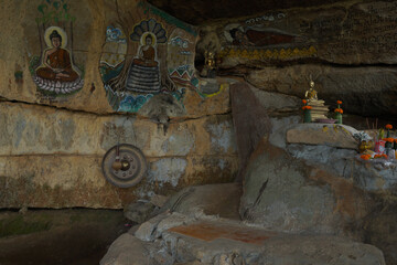 Sticker - Scenic shot of a small temple of worship with drawings of Buddha on the walls