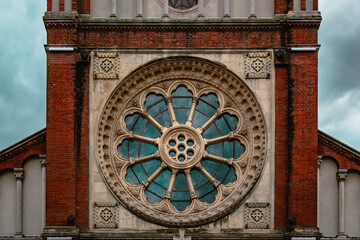 Poster - Exterior view of a facade of a cathedral on a cloudy sky background