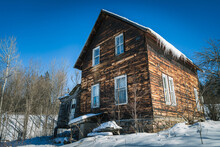 Wooden Old Log House In Winter