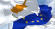 © rarrarorro - Detail of the national flag of Cyprus waving in the wind with blurred european union flag in the background on a clear day