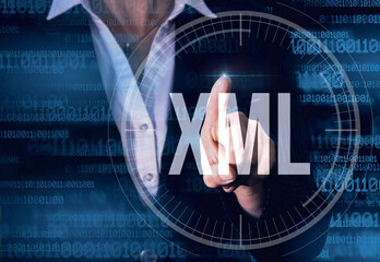 business woman with finger pressing xml button on virtual screens. modern technology concept.
