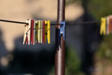 Closeup Shot Of Clothespins On A Rope