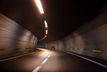 Fast Moving Car Driving In A Tunnel With Lights And With Very Good Quality Of Road Inside It