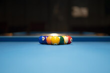 Selective Focus Shot Of An Arranged Blue Pool Table