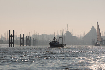 Canvas Print - Scenic view of a motorboat swimming in the sea on a sunny day in Nieuwpoort, Belgium