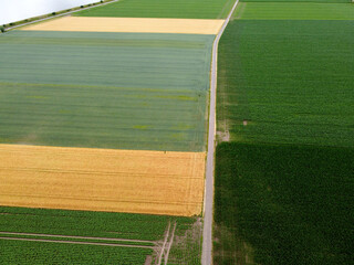 Aerial photo of the flat green and yellow rural areas with strict divisions