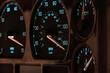 speedometer in car dashboard at full speed in illuminated night mode