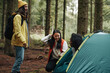 © Flamingo Images - Friends laughing after a night camping