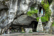 Statue of Virgin Mary in the grotto of Our Lady of Lourdes, France - French famous catholic pilgrimage destination