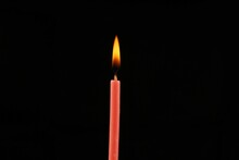 Burning Thin Candle Close-up