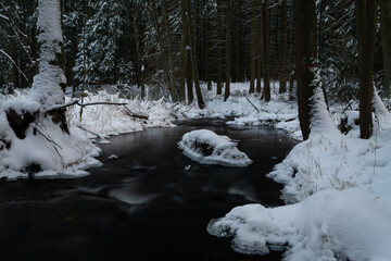 Sticker - Photo of a flowing river and rocks covered in frost and snow