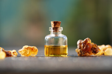 Wall Mural - A bottle of frankincense essential oil with frankincense resin