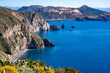 Leinwandbild Motiv Sizilien: Küstenwanderung Insel Lipari - fantastischer Panoramablick auf die Felsen Faraglioni und Vulcano