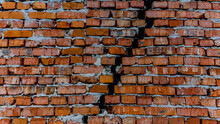 Brick Wall With Crack, Wall Background, Texture. The Concept Of The Old House