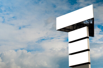 Wall Mural - four blank horizontal white billboards or large displays against blue sky with white clouds - mock u