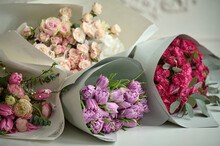 A Several Bouquets Of Flowers Of Different Colors On A Beige Background With Bas-relief