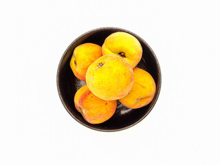 Wall Mural - Fresh peaches fruit on a bowl over a white background