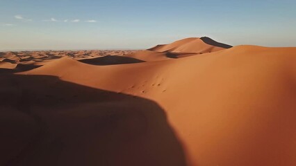 Wall Mural - aerial view on big sand dunes in sahara desert at sunrise, africa, 4k