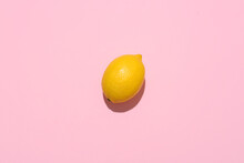 Ripe Lemon On Pink Background, Top View