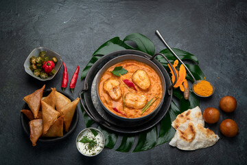 Poster - Kerala fish curry on dark background.