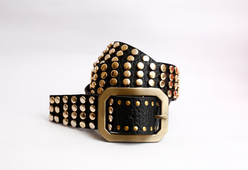 Canvas Print - mens studded leather belt with a metal buckle on white background