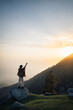© 3 Travelers - Silhouette of a person on a mountain top, Triund Trek, Himachal Pradesh, India.