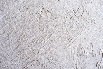 artistic plaster on a gray and white wall. Repairs. elements of wall decor. copy space. texture. background.