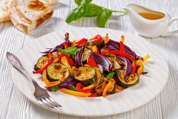 Wall Mural - roast pepper slices with red onion and zucchini