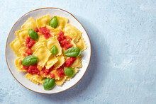 Ravioli With Tomato Sauce And Fresh Basil Leaves, Overhead Shot With A Place For Text. Italian Recipe