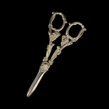 Antique Silver Scissors With Engraving. Vintage Hair Clipper With Flower Pattern On Black Isolated Background