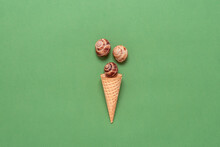Seashells In A Waffle Cone For Ice Cream. Creative Layout. Green Olive Pastel Paper Background. Top View, Flat Lay. Summer Concept.