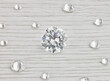 canvas print picture - Loose Scattered Diamonds on White Wooden Background