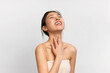 © Prostock-studio - Beauty portrait of young Asian woman touching her neck
