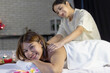© anut21ng Stock - Young Asian woman Gets Massage Spa